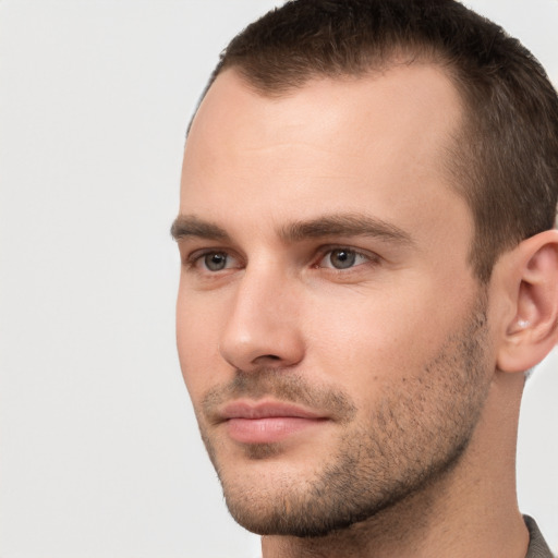 Neutral white young-adult male with short  brown hair and brown eyes