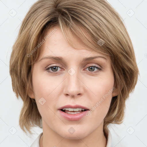 Joyful white young-adult female with medium  brown hair and blue eyes