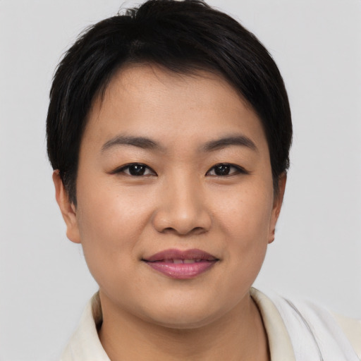 Joyful asian young-adult female with short  brown hair and brown eyes