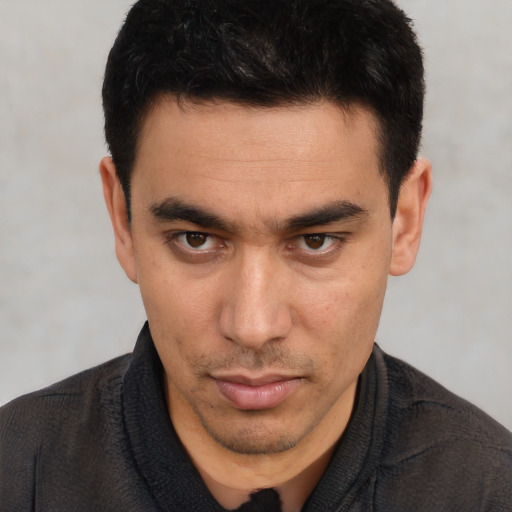 Neutral white young-adult male with short  black hair and brown eyes