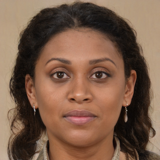 Joyful latino young-adult female with long  brown hair and brown eyes