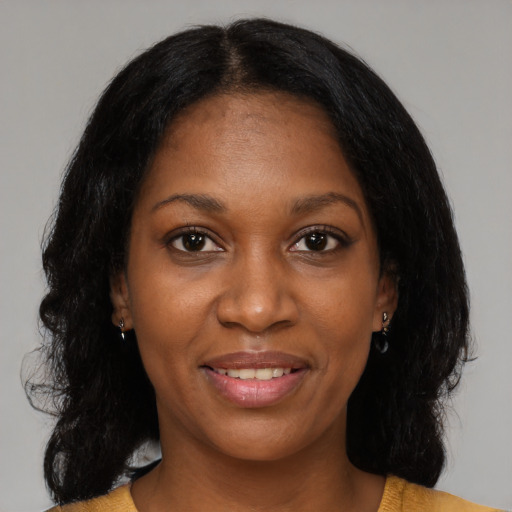 Joyful black young-adult female with medium  black hair and brown eyes