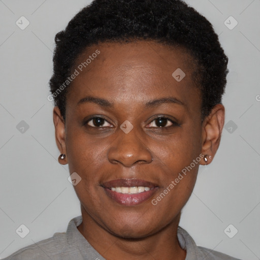 Joyful black young-adult female with short  brown hair and brown eyes