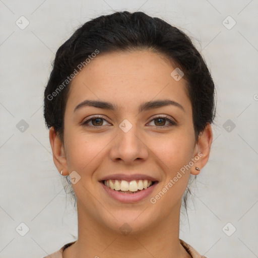 Joyful latino young-adult female with short  brown hair and brown eyes