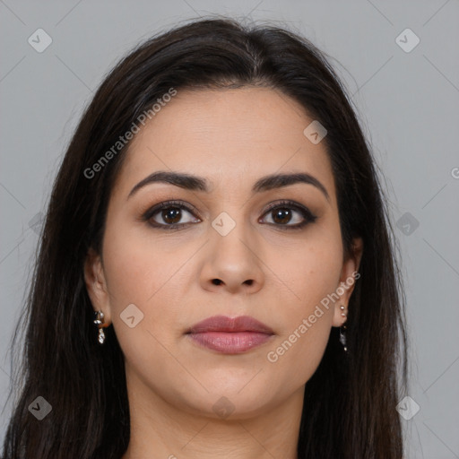 Joyful latino young-adult female with long  brown hair and brown eyes