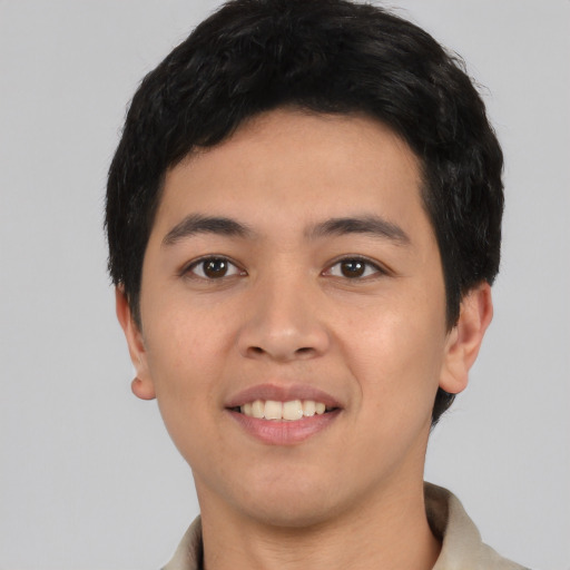 Joyful asian young-adult male with short  black hair and brown eyes