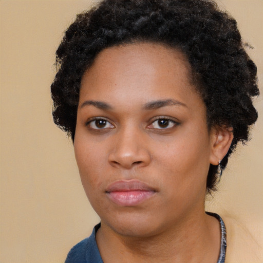 Neutral black young-adult female with short  black hair and brown eyes