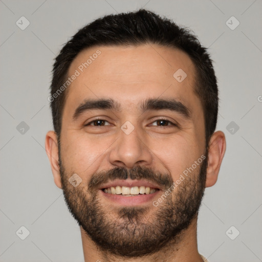 Joyful white young-adult male with short  black hair and brown eyes