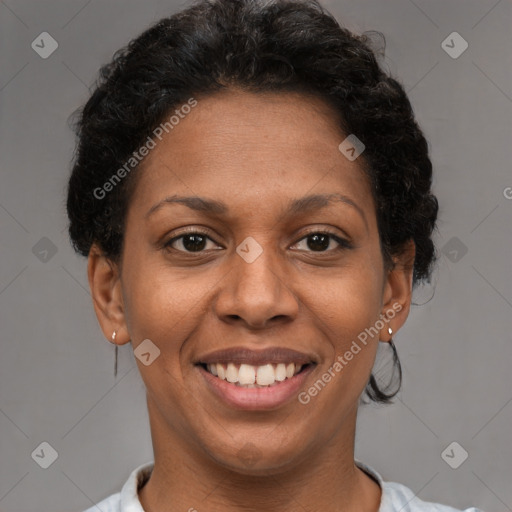 Joyful black adult female with short  brown hair and brown eyes