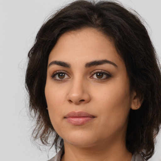 Neutral latino young-adult female with medium  brown hair and brown eyes