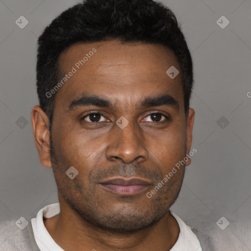 Joyful black young-adult male with short  black hair and brown eyes