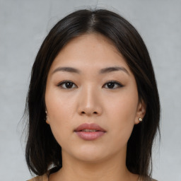 Neutral asian young-adult female with medium  brown hair and brown eyes