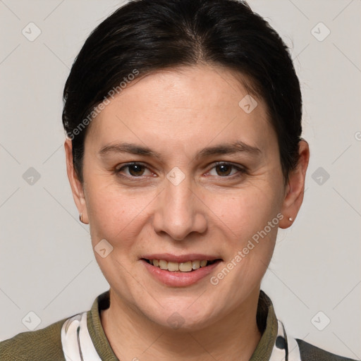 Joyful white adult female with short  brown hair and grey eyes