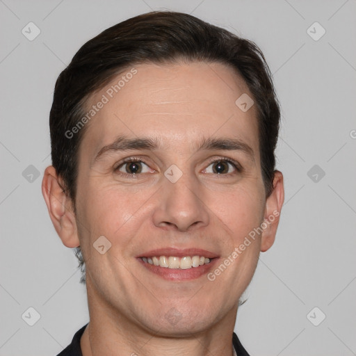 Joyful white adult male with short  brown hair and grey eyes