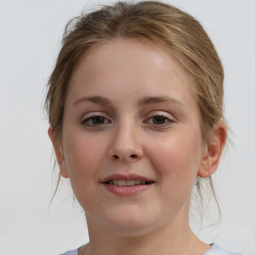 Joyful white child female with medium  brown hair and blue eyes