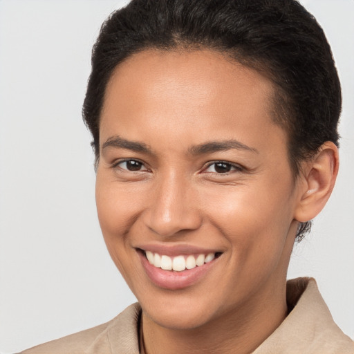 Joyful white young-adult female with short  brown hair and brown eyes