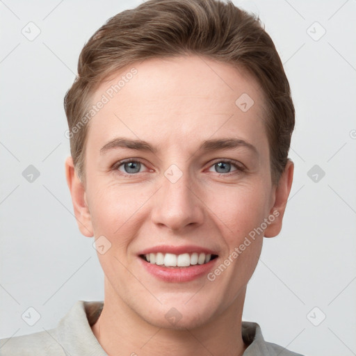 Joyful white young-adult female with short  brown hair and grey eyes