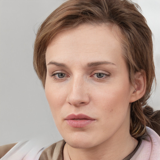 Neutral white young-adult female with medium  brown hair and grey eyes