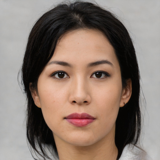 Neutral asian young-adult female with medium  black hair and brown eyes