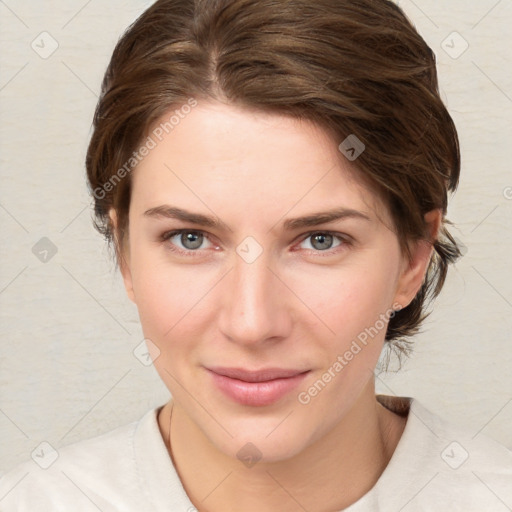 Joyful white young-adult female with medium  brown hair and green eyes