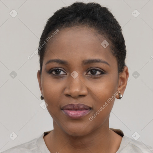 Joyful black young-adult female with short  black hair and brown eyes