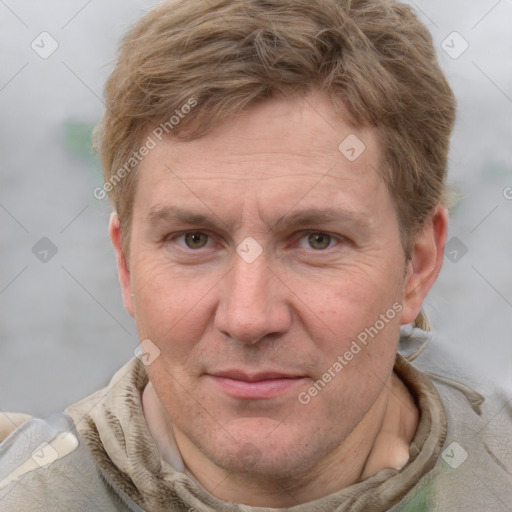 Joyful white adult male with short  brown hair and grey eyes