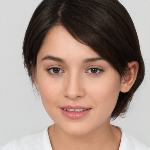 Joyful white young-adult female with medium  brown hair and brown eyes