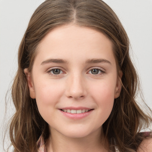 Joyful white child female with long  brown hair and grey eyes