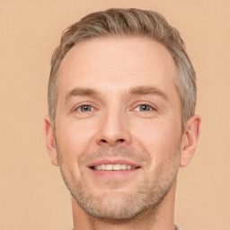 Joyful white adult male with short  brown hair and brown eyes