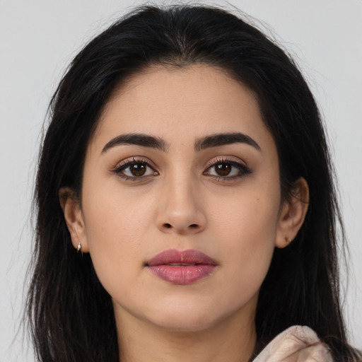Neutral latino young-adult female with long  brown hair and brown eyes