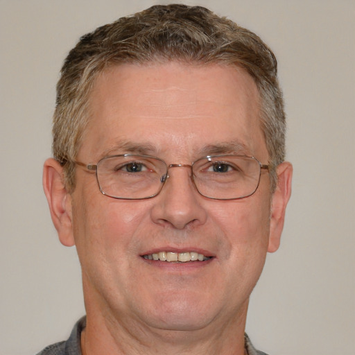 Joyful white middle-aged male with short  brown hair and brown eyes