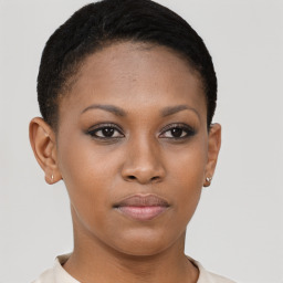 Joyful black young-adult female with short  brown hair and brown eyes
