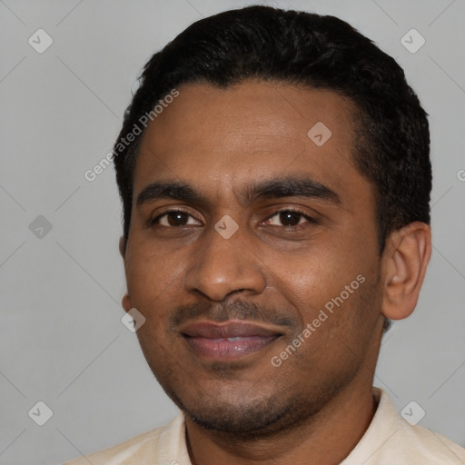 Joyful black young-adult male with short  black hair and brown eyes