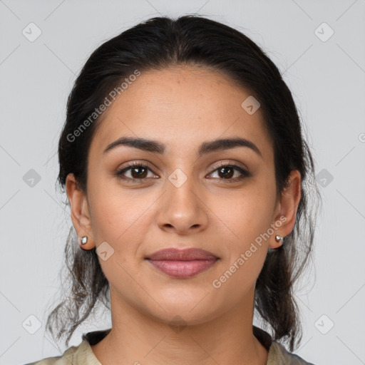 Joyful latino young-adult female with medium  brown hair and brown eyes