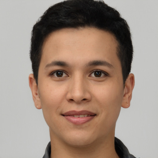 Joyful white young-adult male with short  black hair and brown eyes