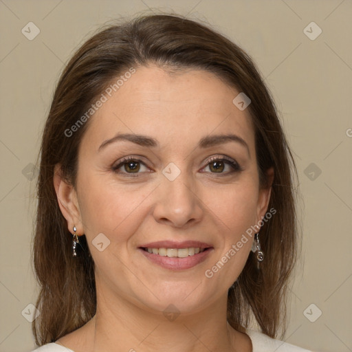 Joyful white adult female with medium  brown hair and brown eyes