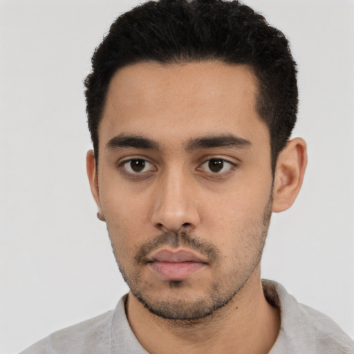 Neutral latino young-adult male with short  black hair and brown eyes