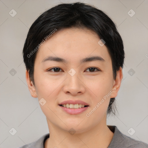 Joyful asian young-adult female with short  black hair and brown eyes