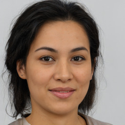 Joyful asian young-adult female with medium  brown hair and brown eyes