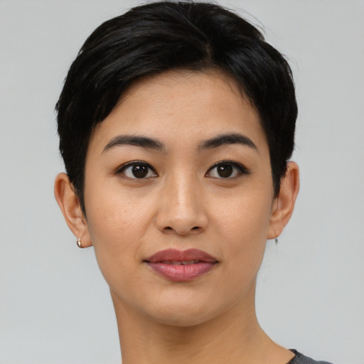 Joyful asian young-adult female with short  black hair and brown eyes