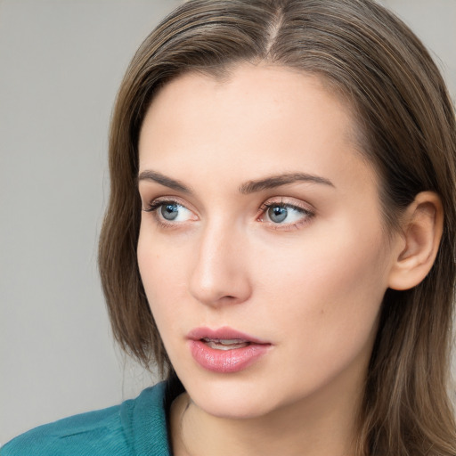 Neutral white young-adult female with long  brown hair and grey eyes