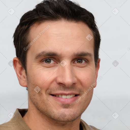 Joyful white adult male with short  brown hair and grey eyes