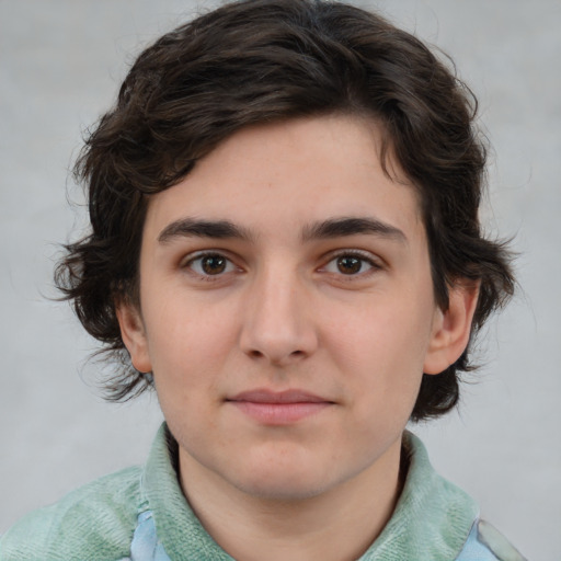 Joyful white young-adult male with medium  brown hair and brown eyes