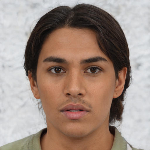Neutral latino young-adult male with short  brown hair and brown eyes