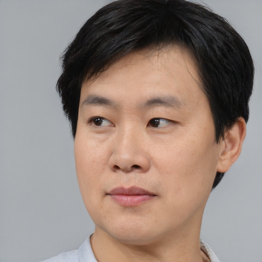 Neutral asian young-adult male with short  black hair and brown eyes