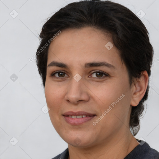 Joyful white adult female with medium  brown hair and brown eyes