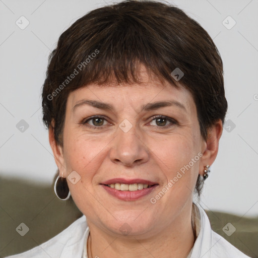 Joyful white adult female with short  brown hair and brown eyes