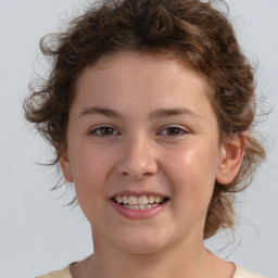 Joyful white child female with medium  brown hair and brown eyes