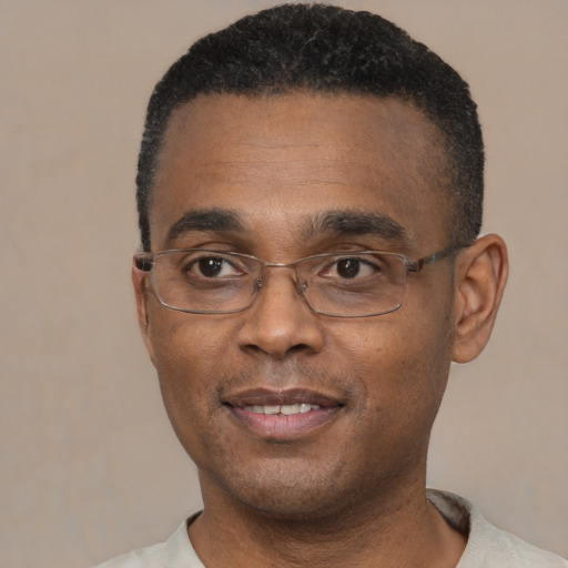 Neutral black adult male with short  black hair and brown eyes