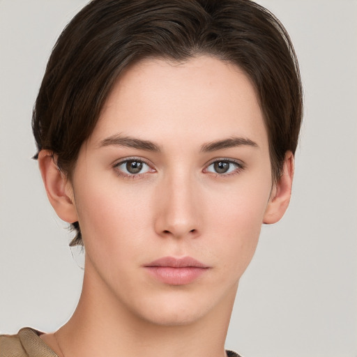 Neutral white young-adult female with short  brown hair and brown eyes